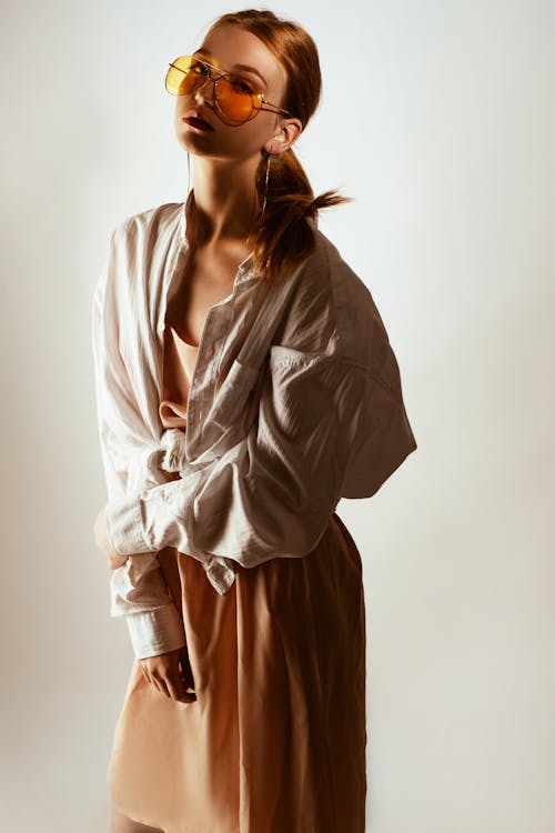 Woman crouching and posing in casual attire