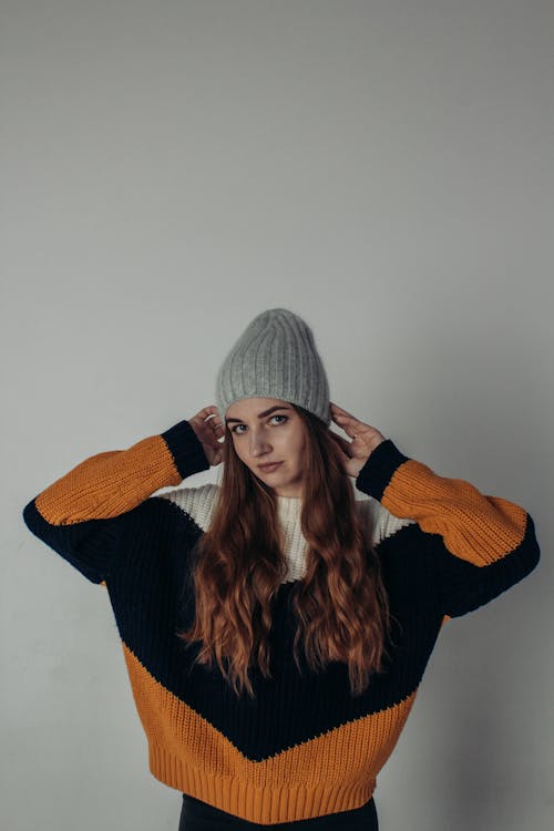 Woman crouching and posing in casual attire