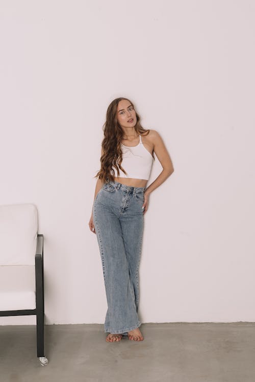 Woman crouching and posing in casual attire