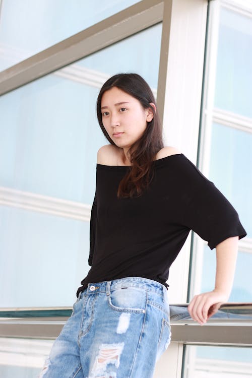 Woman crouching and posing in casual attire