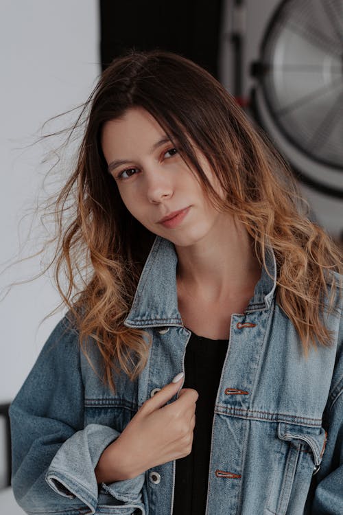 Woman crouching and posing in casual attire