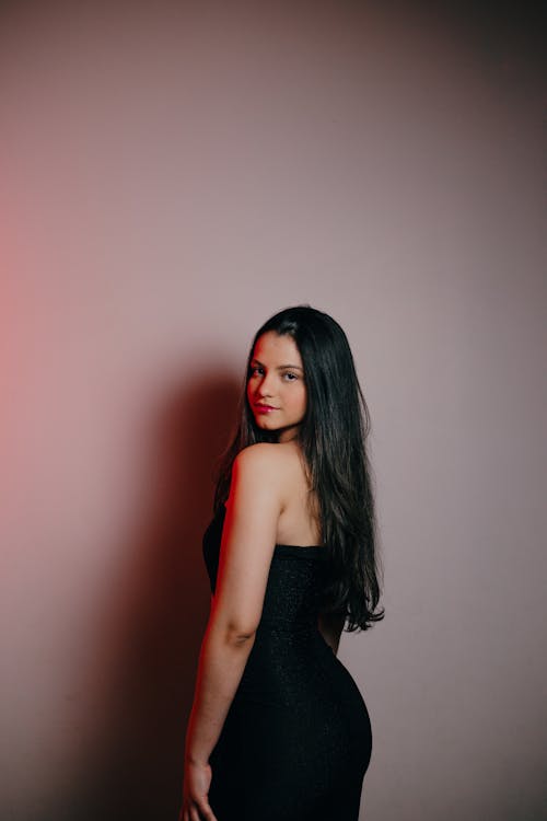 Woman crouching and posing in casual attire