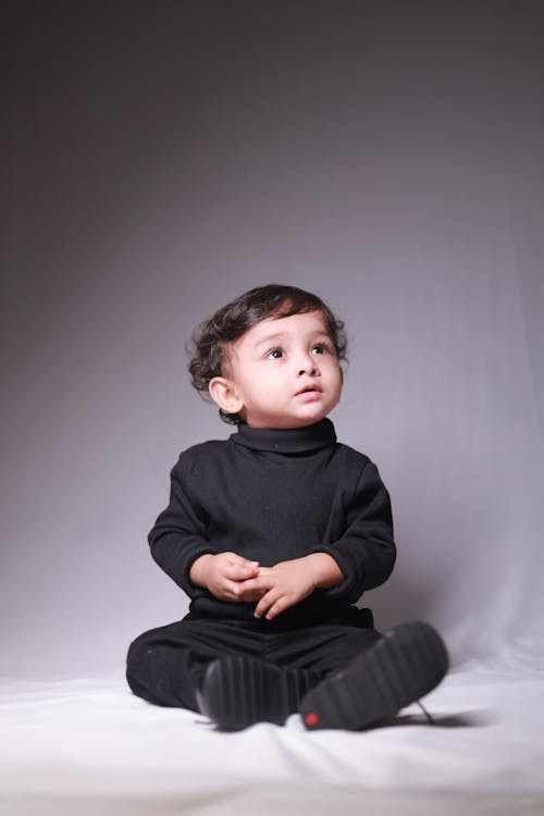 Woman crouching and posing in casual attire