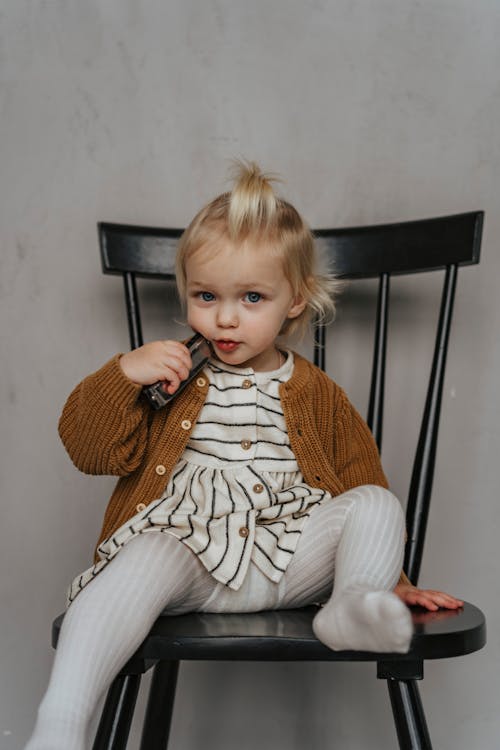 Woman crouching and posing in casual attire