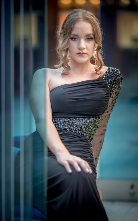 Woman crouching and posing in casual attire