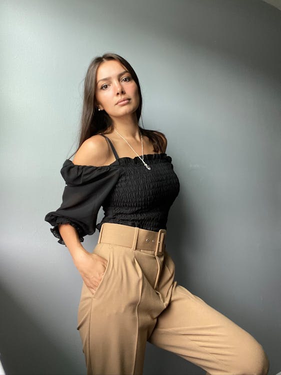 Woman crouching and posing in casual attire