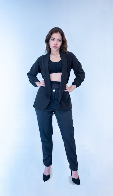 Woman crouching and posing in casual attire