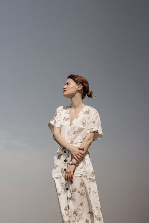 Woman crouching and posing in casual attire
