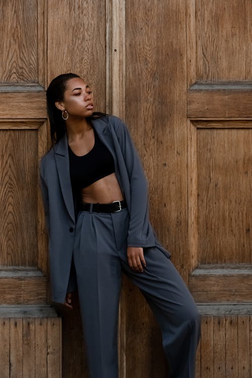 Woman crouching and posing in casual attire